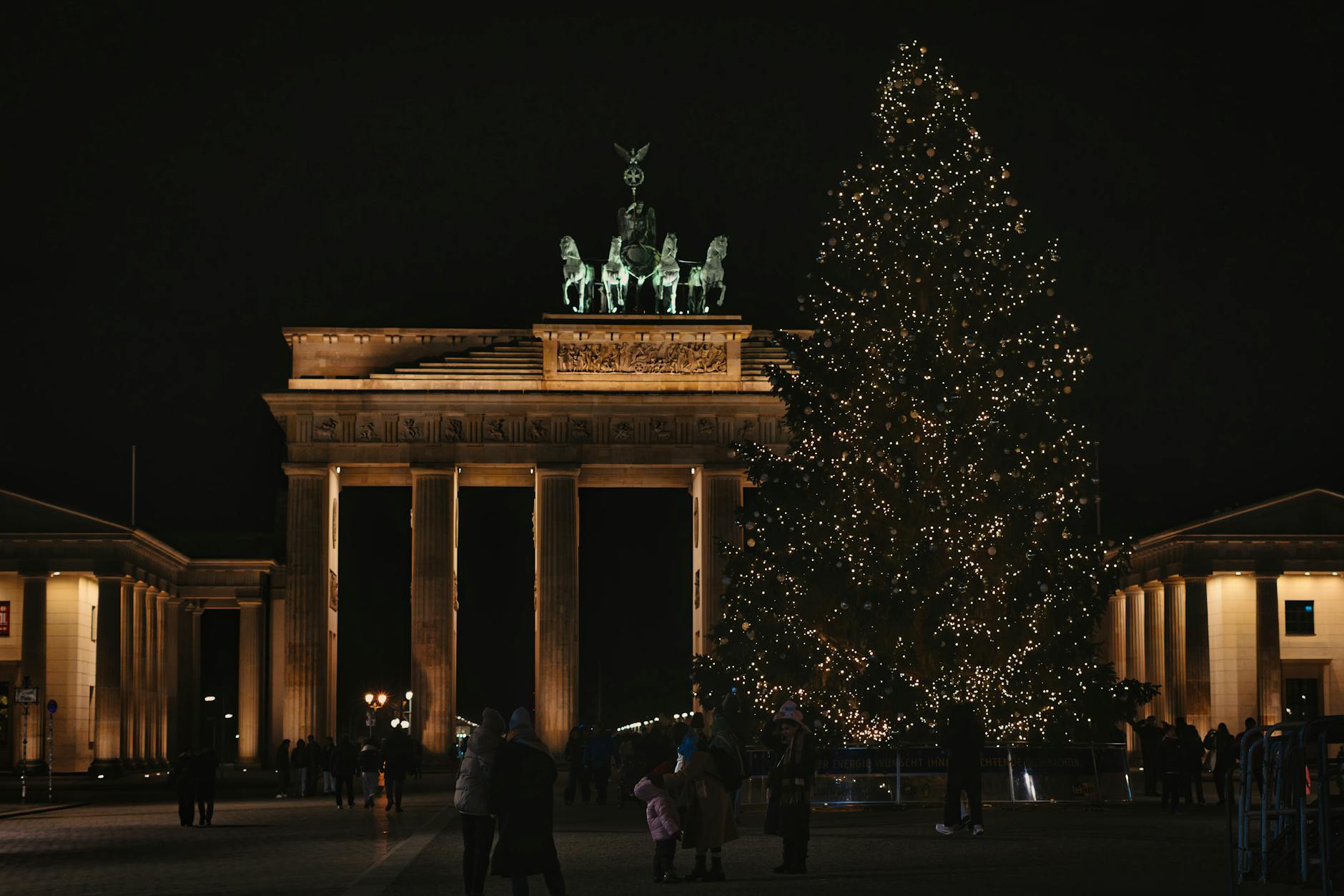 Beautiful night view of Brandenburg Gate with a Christmas tree in Berlin, Germany.